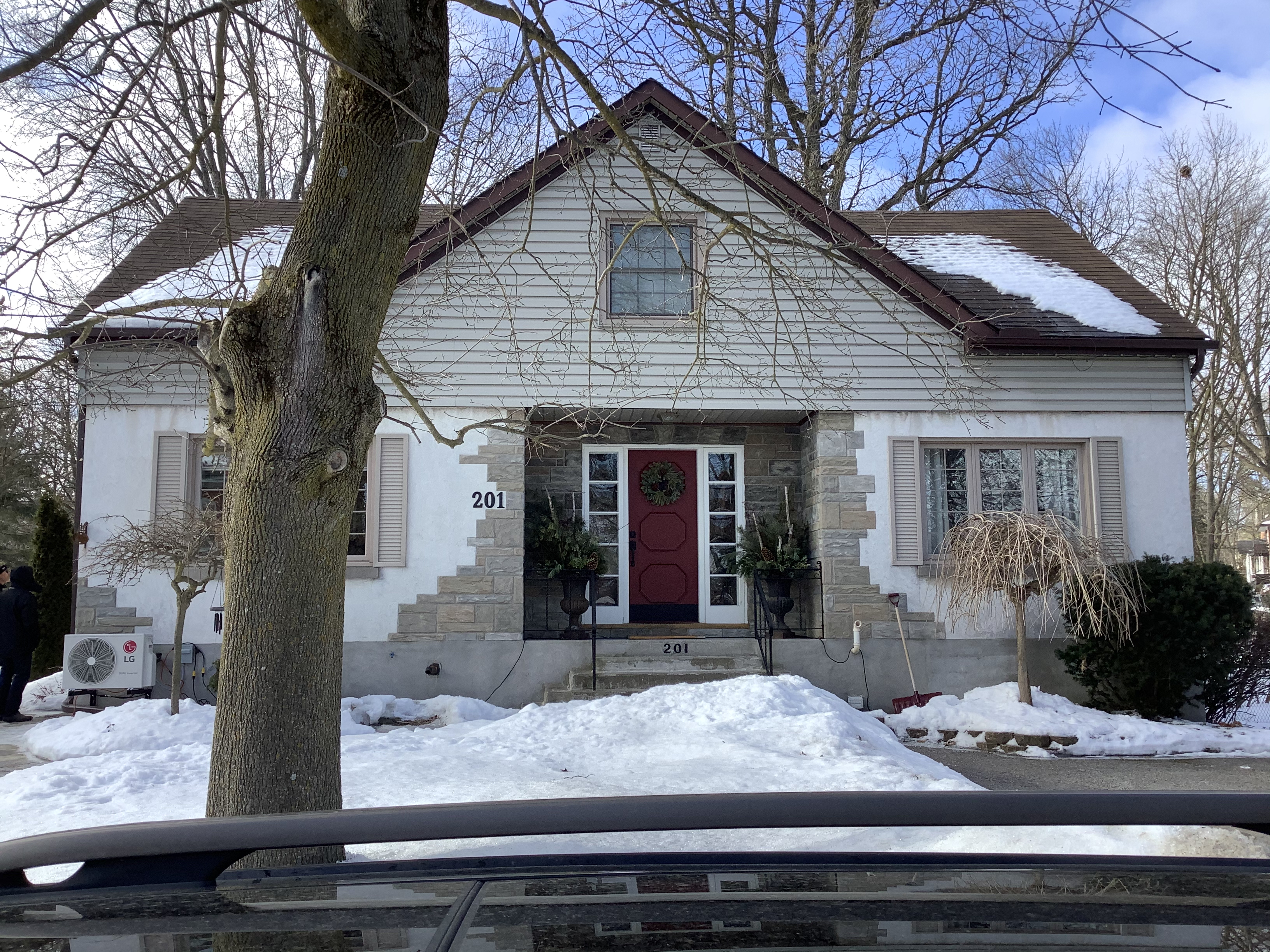 Home exterior before the portico and stucco renovation